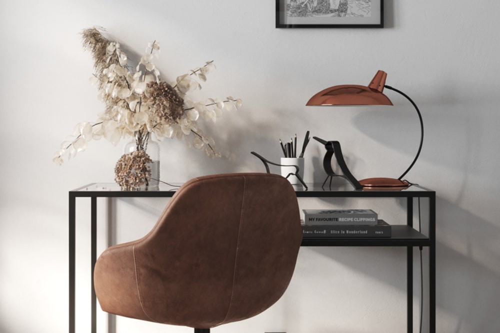 Chic desk and flowers for home office at The Kelvin in Huntsville, Alabama