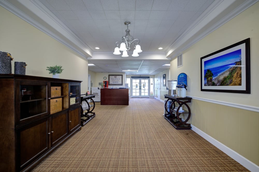 Large hallway leading to reception area at Pacifica Senior Living Encinitas in Encinitas, California