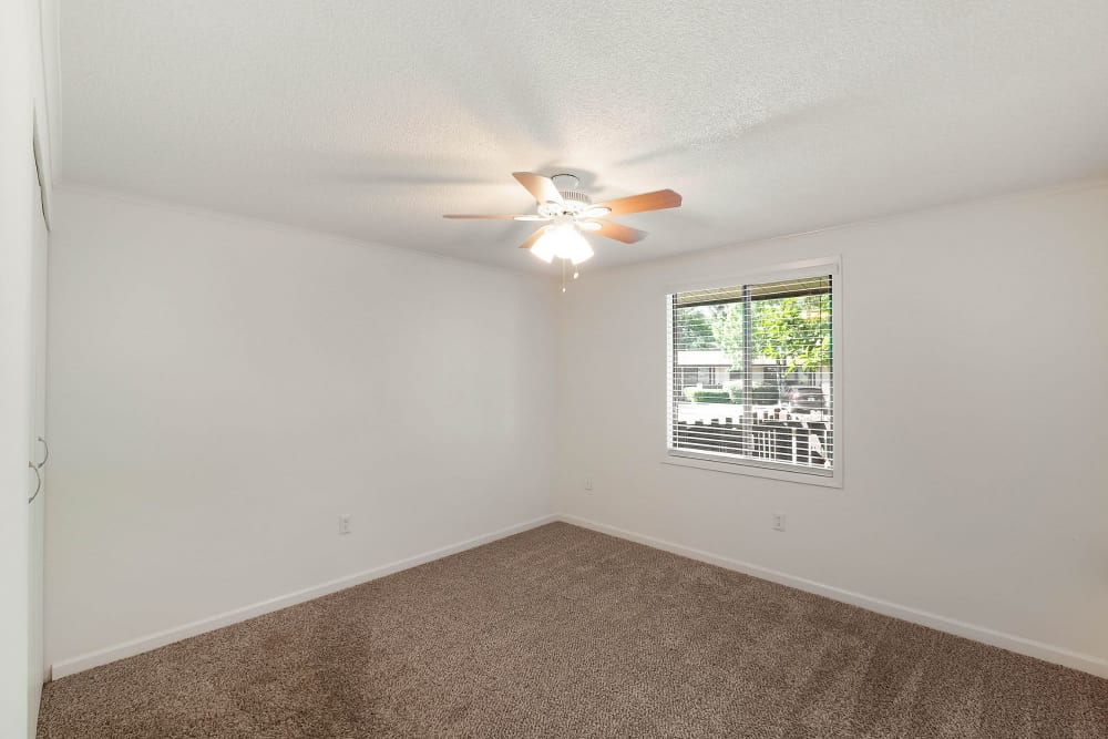 Bedroom with ceiling fan at Lakeshore II Apartments in Fort Oglethorpe, Georgia
