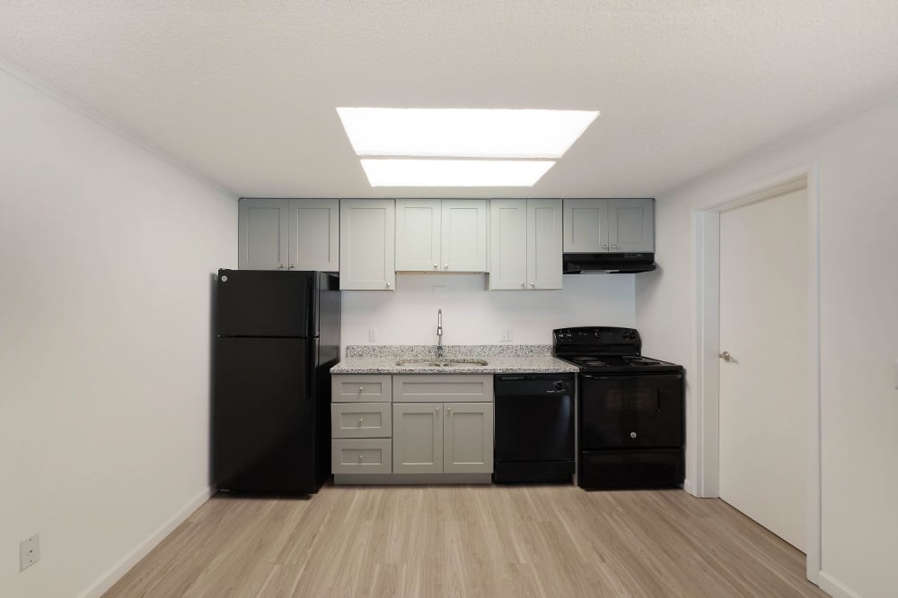 Kitchen with black appliances at Lakeshore II Apartments in Fort Oglethorpe, Georgia