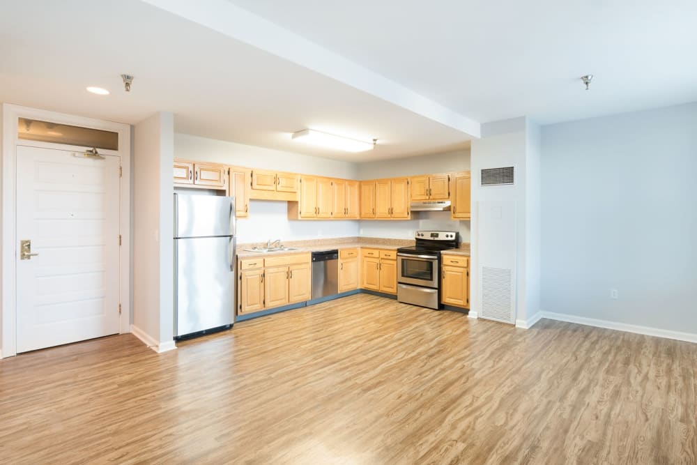 Kitchen with beautiful hardwood flooring at The Grand Apartments in Chattanooga, Tennessee