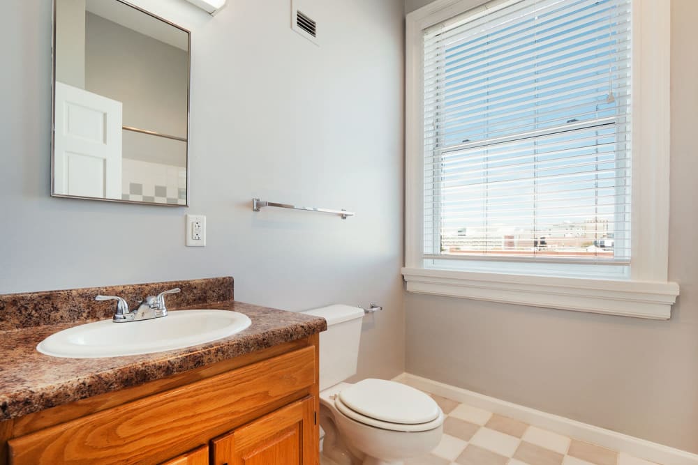 Bathroom with great lighting at The Grand Apartments in Chattanooga, Tennessee