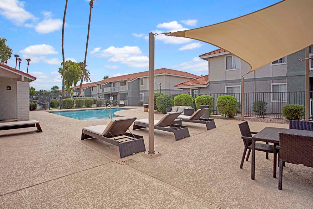 Lounge chairs by the pool at 505 West Apartment Homes in Tempe, Arizona