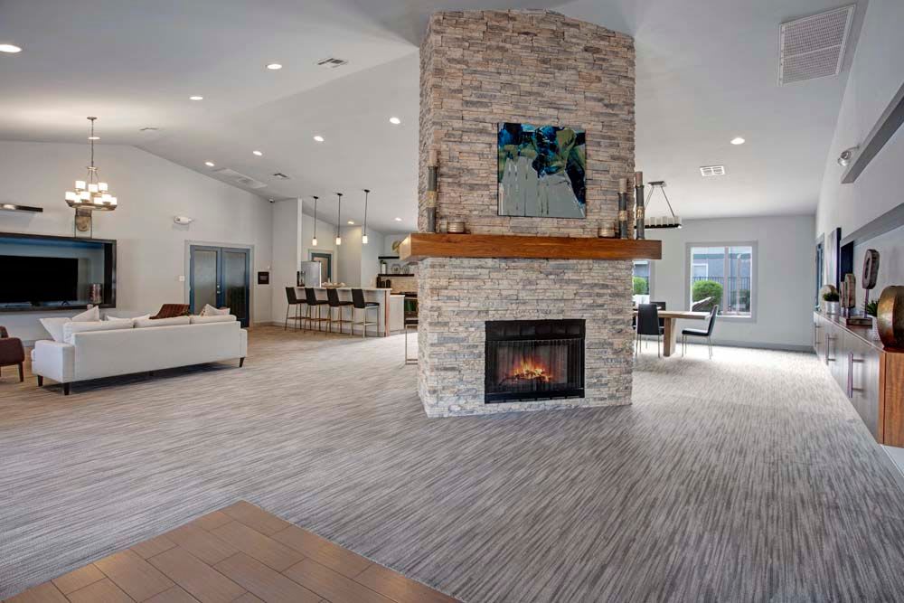 Resident clubroom with a fireplace at 505 West Apartment Homes in Tempe, Arizona