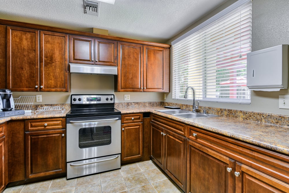Apartment kitchen at Windsor Court & Stratford Place in Westminster, California