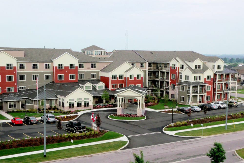 A rendering of the parking lot and main entrance at Cedarview Gracious Retirement Living in Woodstock, Ontario