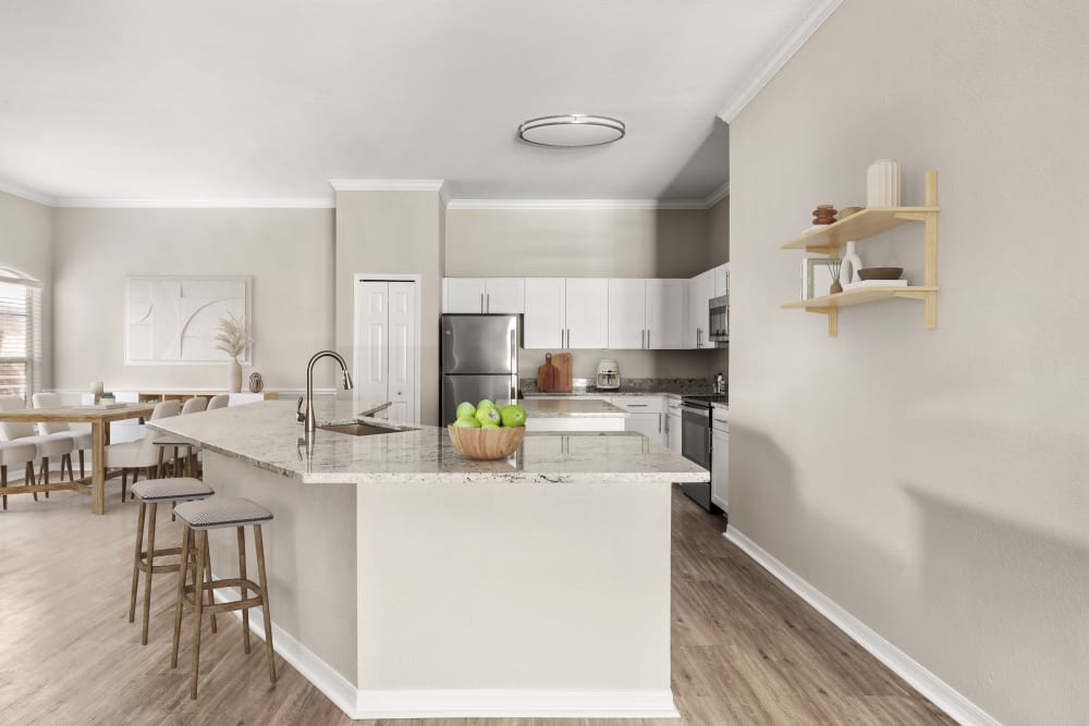 Gourmet kitchen with an island in a model home at Cape House in Jacksonville, Florida