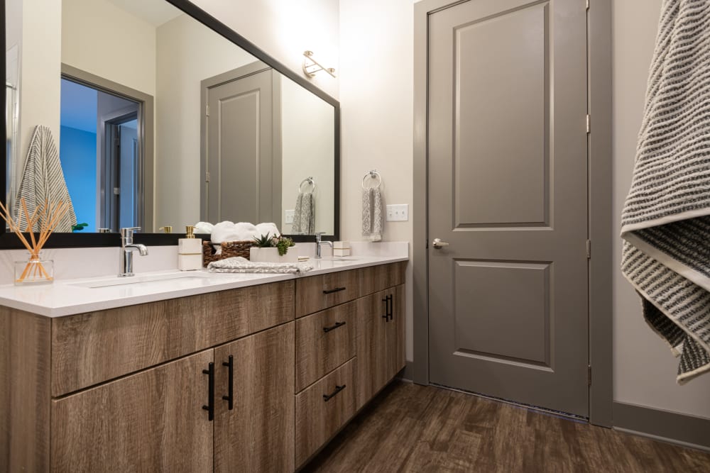 Bathroom with oversized vanity and ample storage space at The Reserve at Patterson Place in Durham, North Carolina