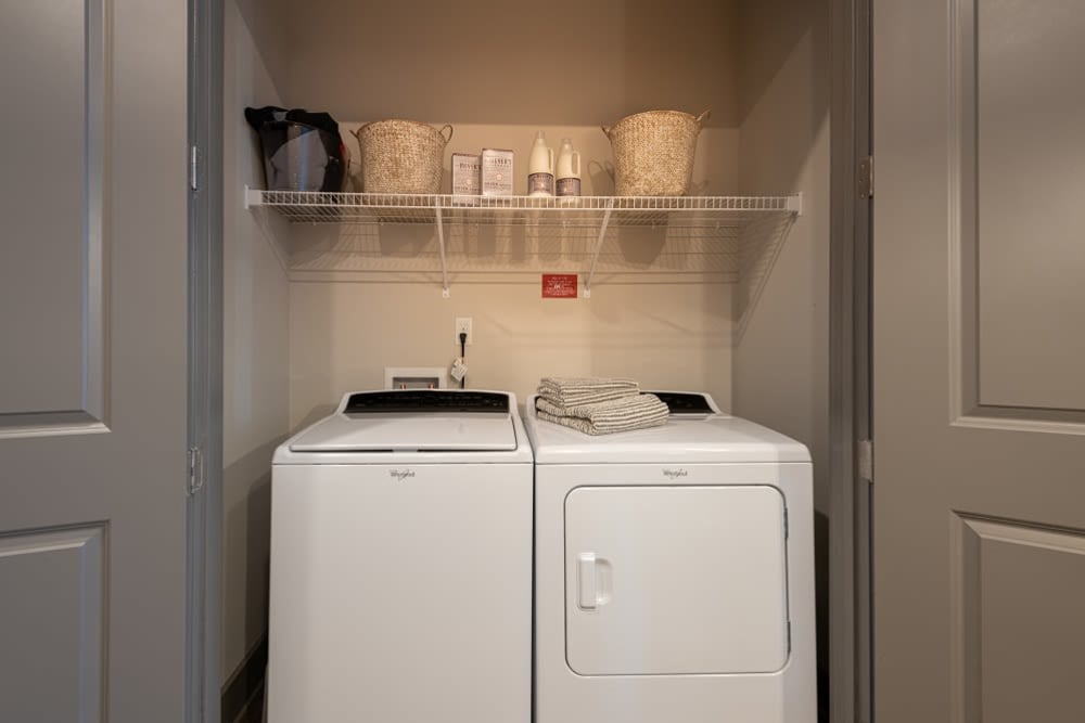 Full size washer and dryer in a model apartment home at The Reserve at Patterson Place in Durham, North Carolina