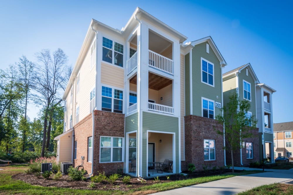Outside view of the 3 story complex looking great at The Reserve at White Oak in Garner, North Carolina