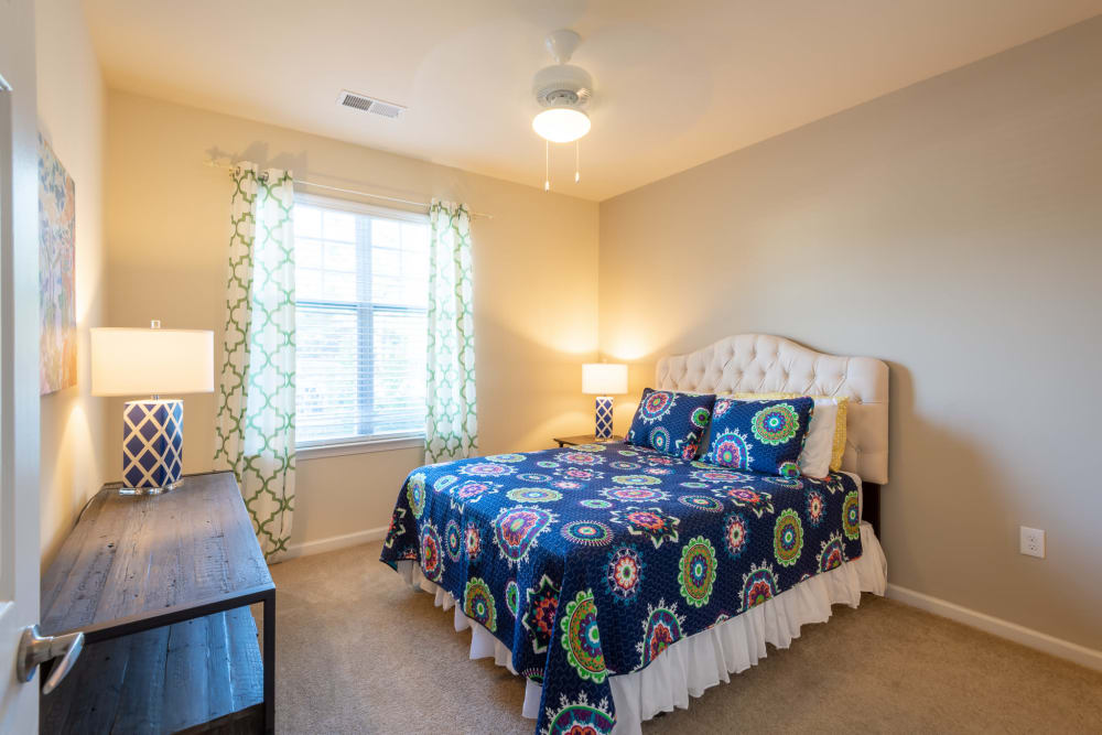 Spacious bedroom with large windows and tons of light at The Reserve at White Oak in Garner, North Carolina