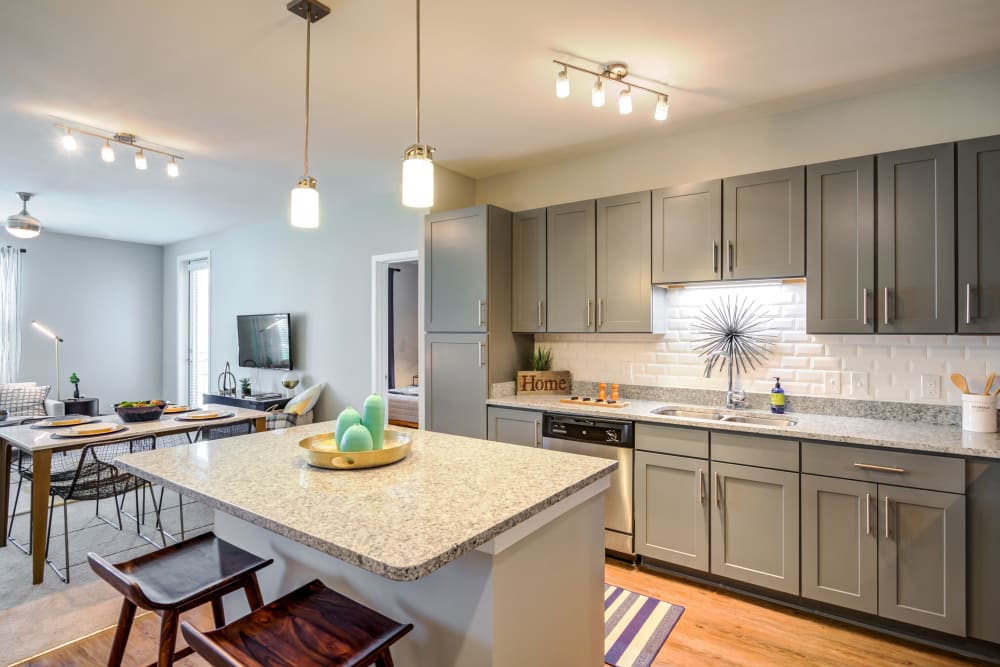 Gorgeous kitchen with great lighting at Flats At 540 in Apex, North Carolina