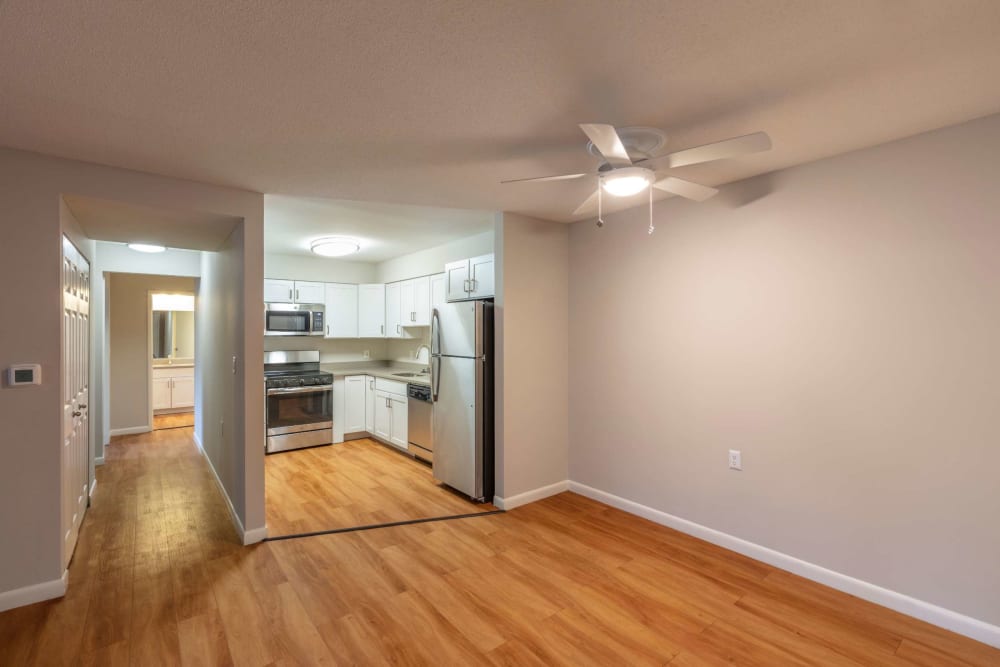 Open floor space leading to kitchen at Bay Ridge at Nashua Apartments in Nashua, New Hampshire