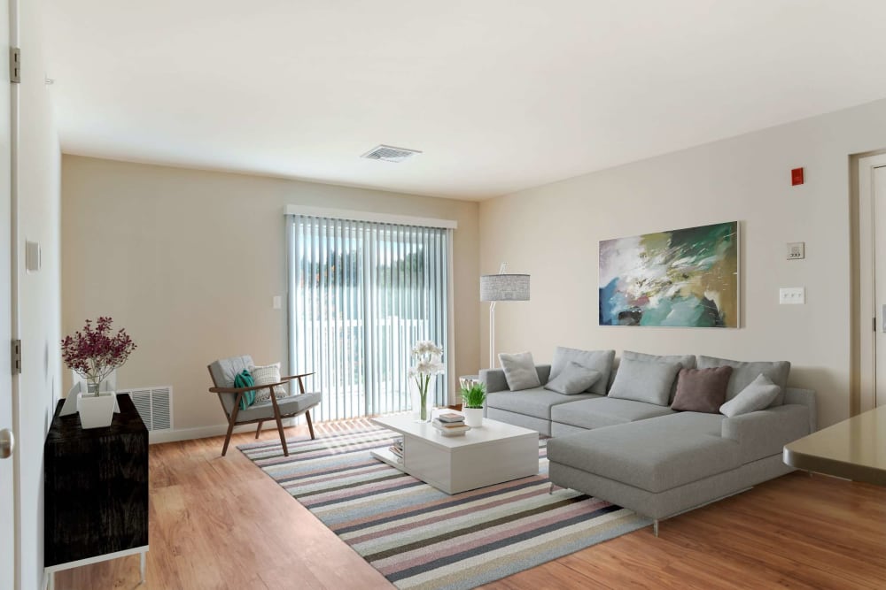 Open space living room with patio access at Bay Ridge at Nashua Apartments in Nashua, New Hampshire