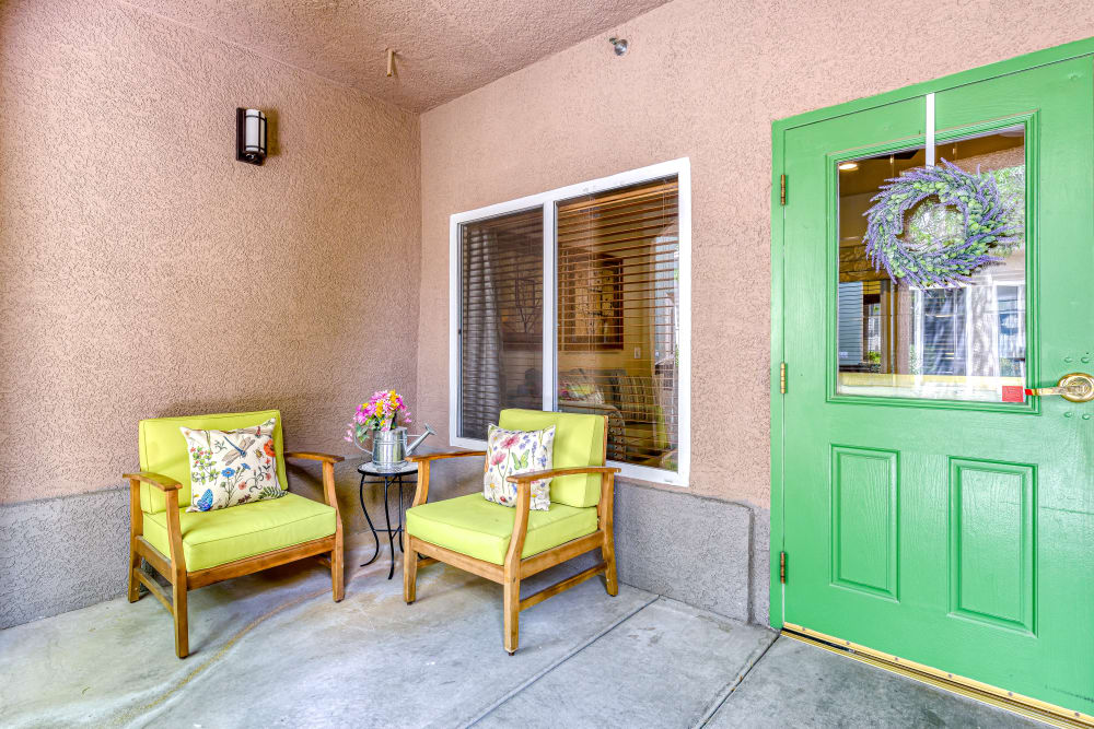 Two yellow couches on a terrace at Pacifica Senior Living Green Valley in Henderson, Nevada
