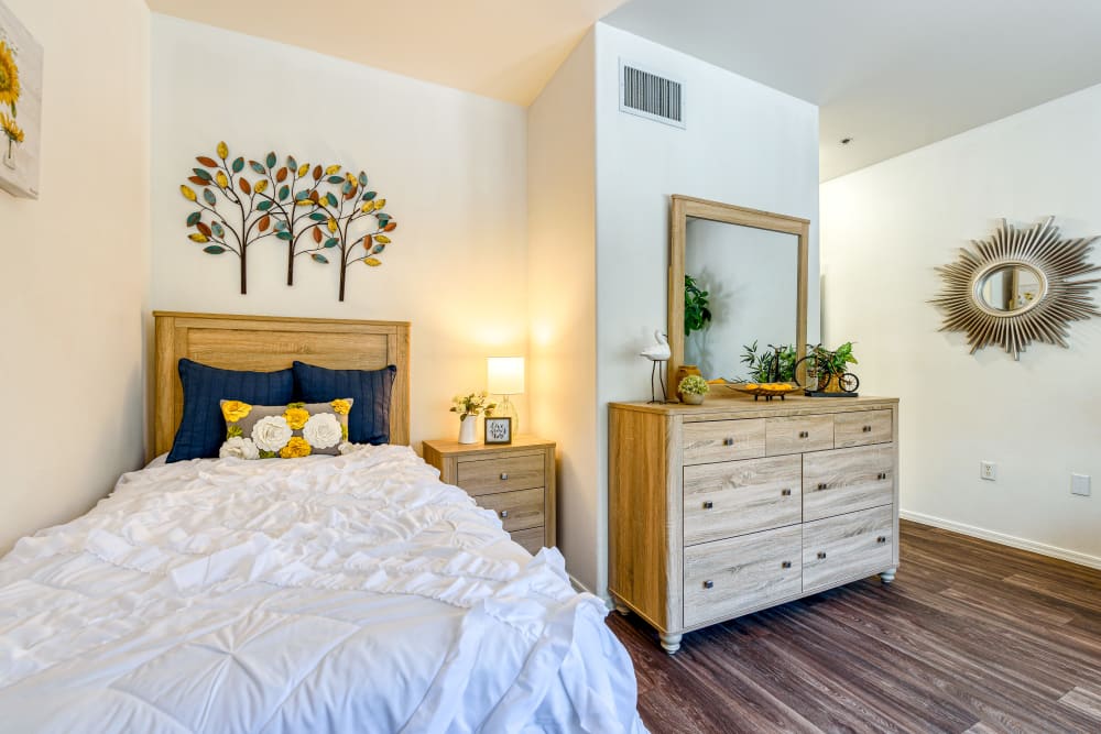 Small bedroom with side table at Pacifica Senior Living Green Valley in Henderson, Nevada