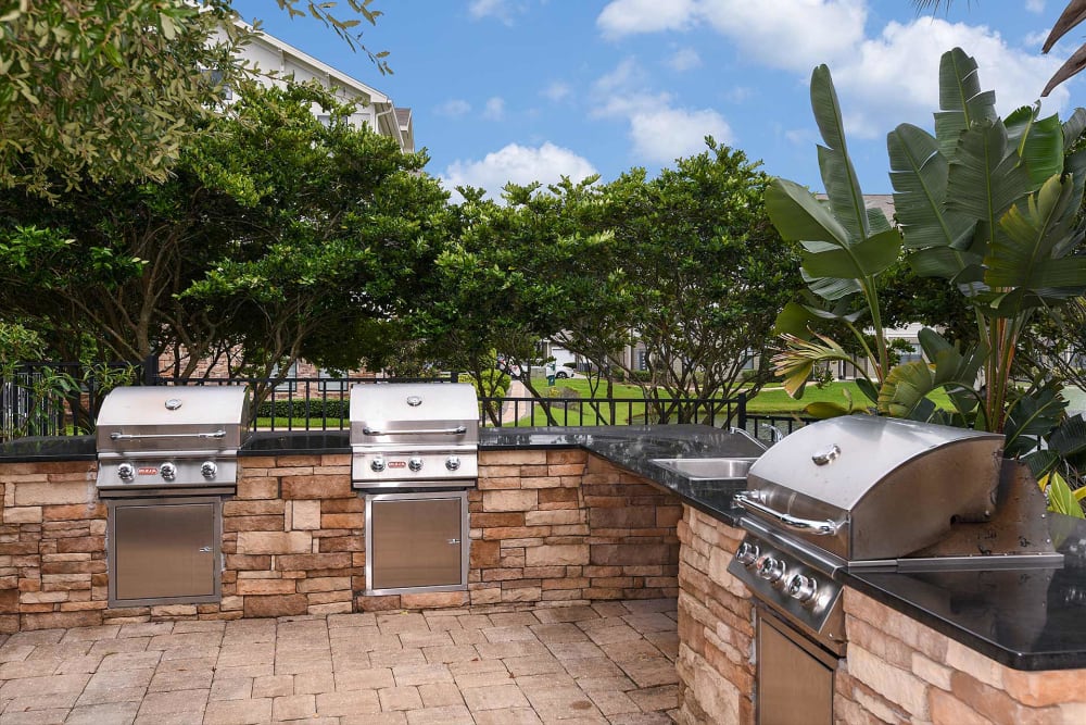 Grills by the pool at Terraces at Town Center in Jacksonville, Florida