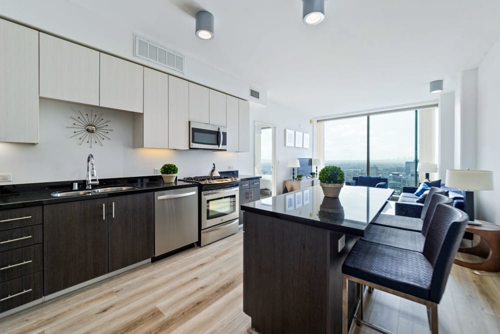 Open floor plan with kitchen island at The Vermont in Los Angeles, California