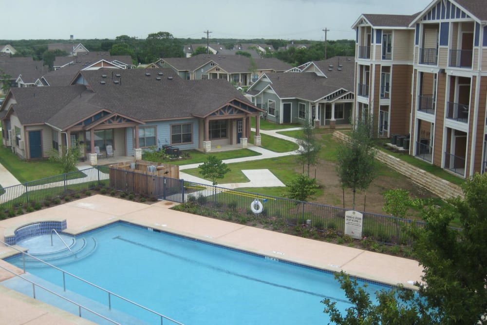 Aerial view of the community swimming pool at Mariposa at River Bend in Georgetown, Texas
