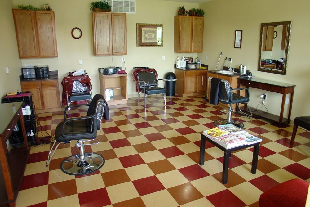 Seating in an onsite barber shop at Mariposa at River Bend in Georgetown, Texas