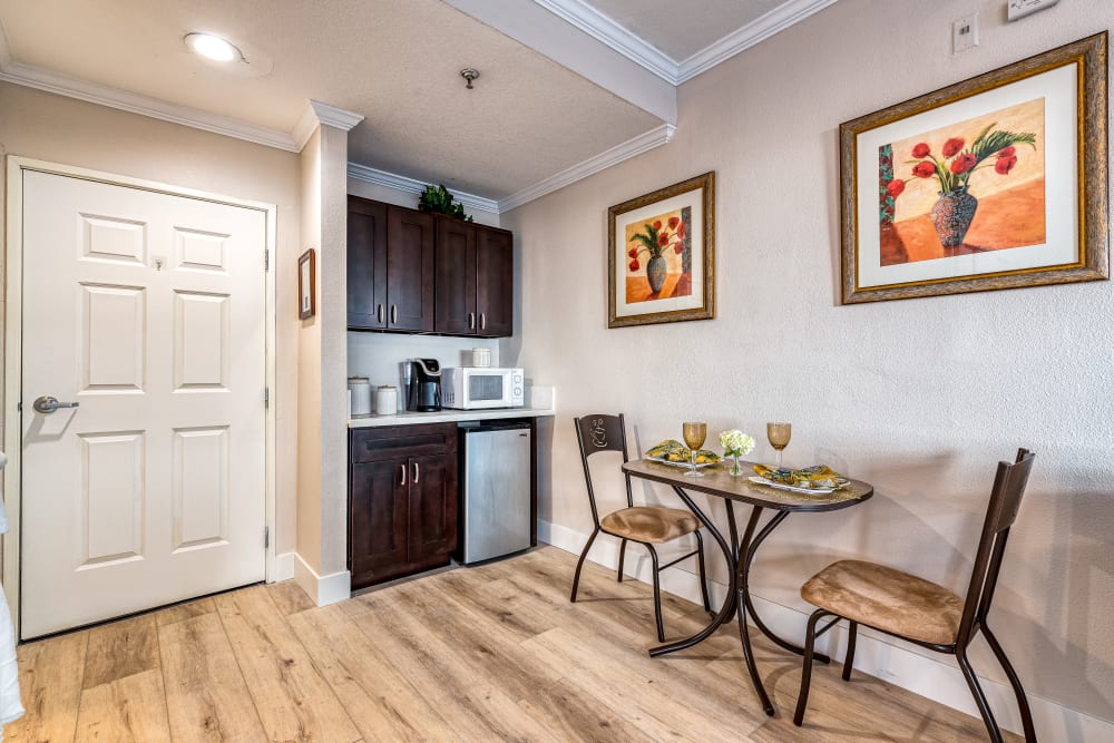 Small  kitchen and Dining Area for two at  Pacifica Senior Living Santa Clarita in Newhall, California