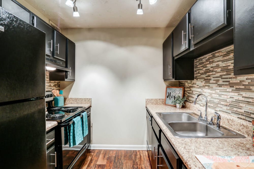 Full kitchen with modern appliances at Candlewood Apartment Homes in Nashville, Tennessee