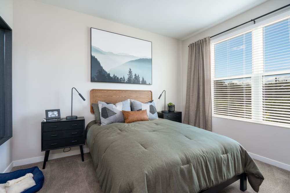 Model bedroom with large windows at Anson in Burlingame, California