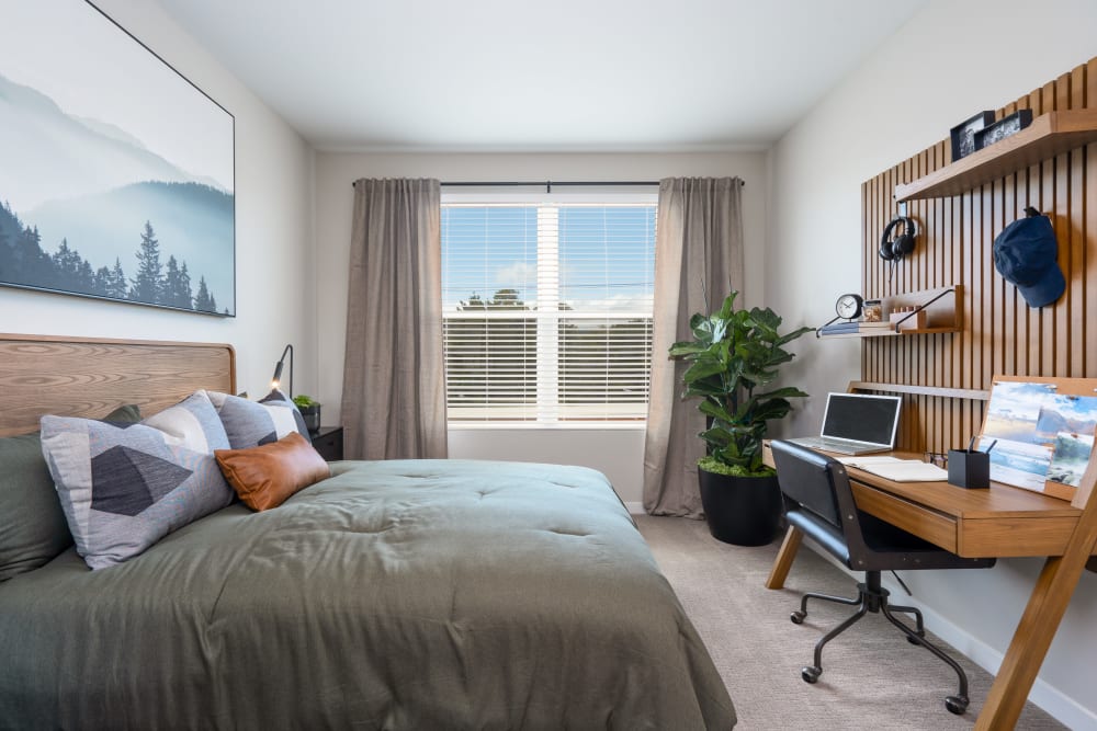 Large windows supply this bedroom at Anson in Burlingame, California with lots of natural light 