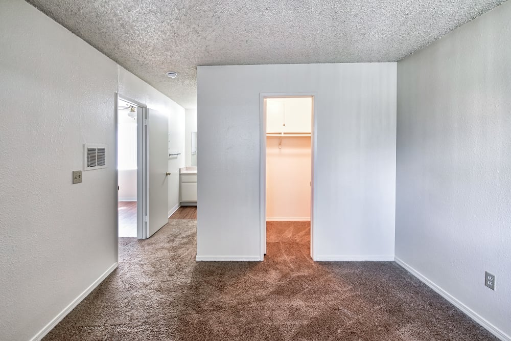 Apartment bedroom with walk in closet at The Palms Apartments in Rowland Heights, California