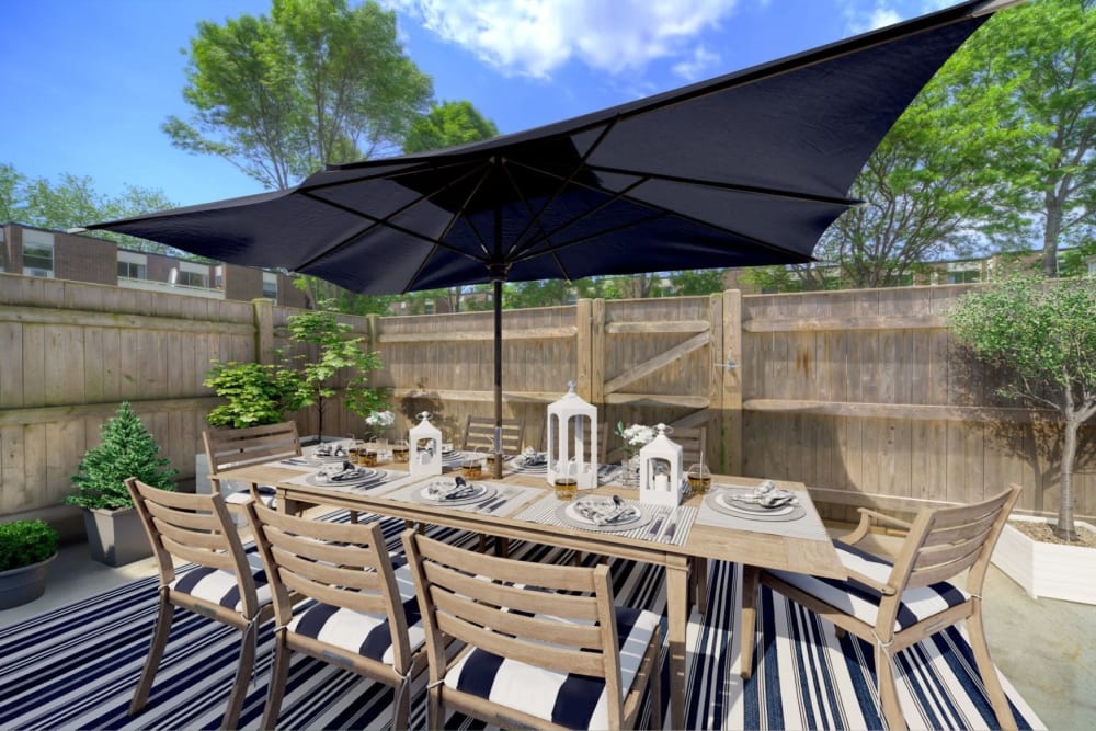 Patio deck with modern seating at Eagle Rock Apartments & Townhomes at Brighton in Brighton, Massachusetts
