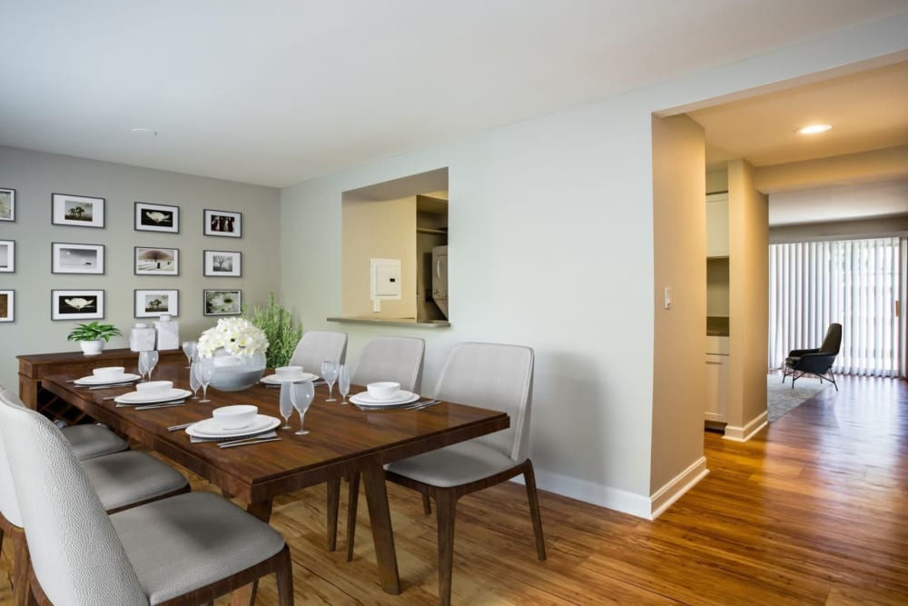 Dining room with long table at Eagle Rock Apartments & Townhomes at Brighton in Brighton, Massachusetts