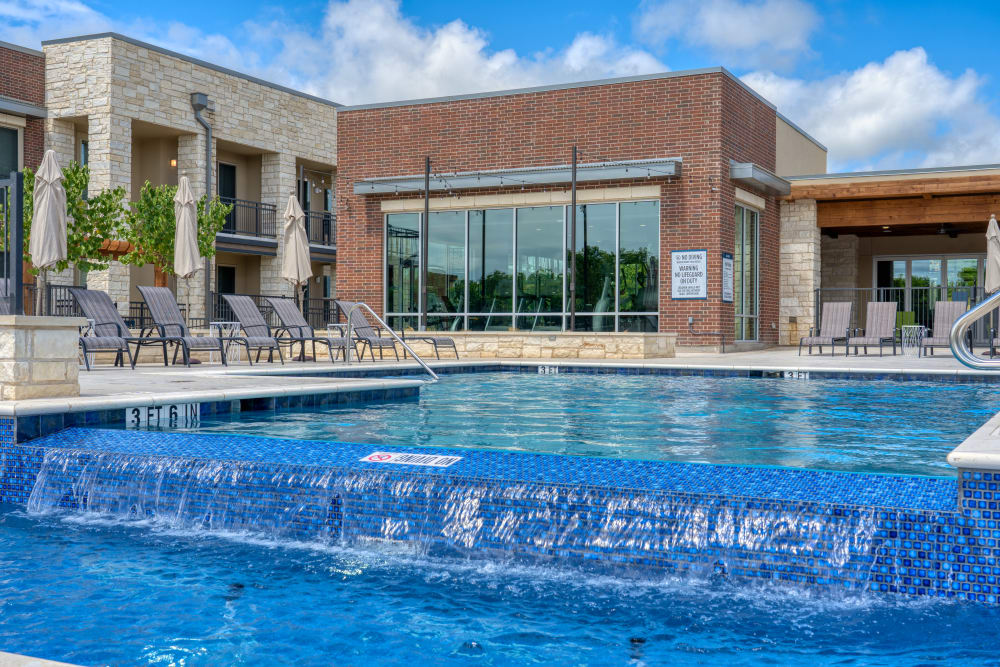 Sparking swimming pool and lounge area at The Gates at Meadow Place in Willow Park, Texas