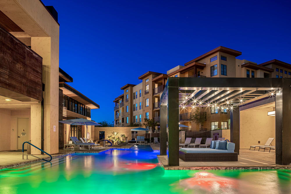 Lounge area surrounded by pool at Marquis at Desert Ridge in Phoenix, Arizona