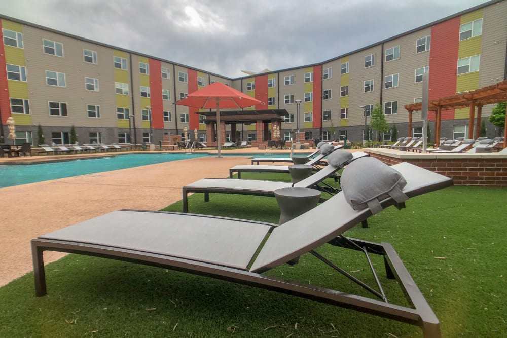 lounge area by swimming pool at  Terra at University North Park in Norman, Oklahoma