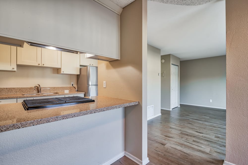 apartment kitchen and living room at Sycamore Court in Garden Grove, California