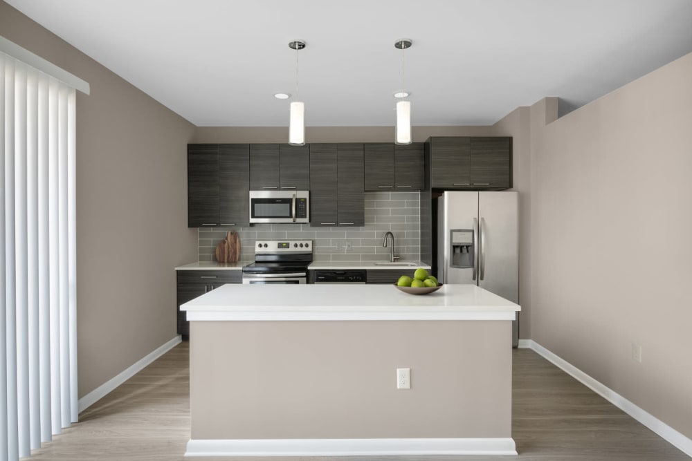 Model kitchen with island at The Palmer in Charlotte, North Carolina