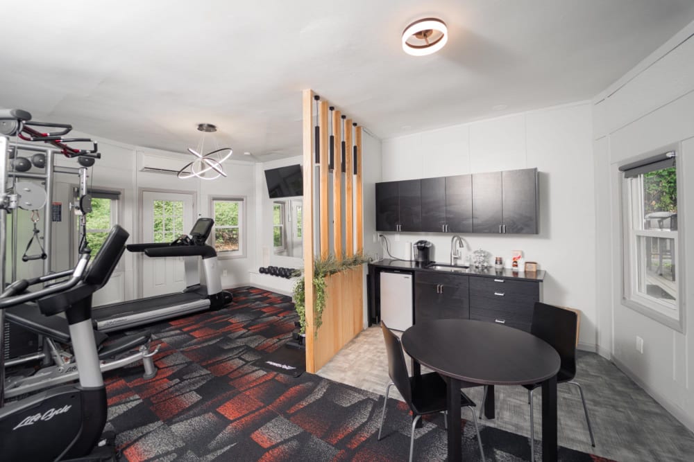 Modern fitness center with kitchen area at Woodbury Knoll in Woodbury, Connecticut