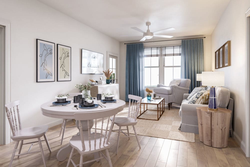 Modern living room with dining table at The Griffon Vero Beach in Vero Beach, Florida