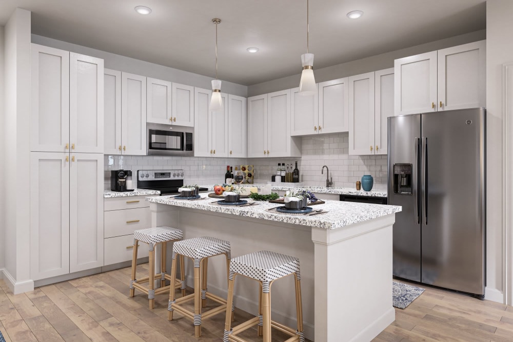 Kitchen with white cabinet and appliance at The Griffon Vero Beach in Vero Beach, Florida