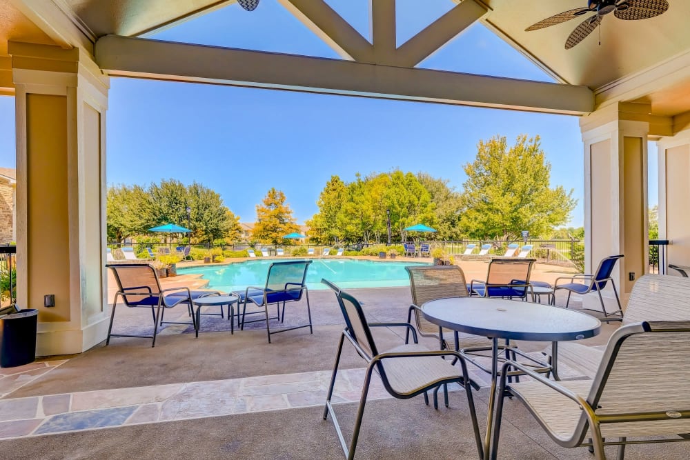 Clubhouse and swimming pool lounge area at River Walk Apartment Homes in Shreveport, Louisiana