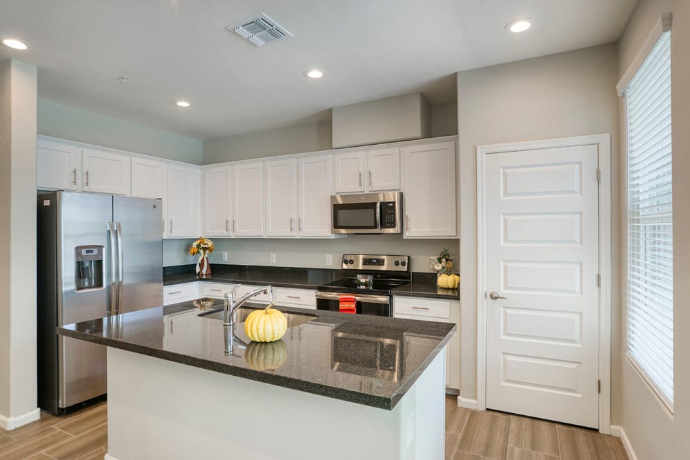 Kitchen with white cabinets at BB Living at Val Vista in Gilbert, Arizona