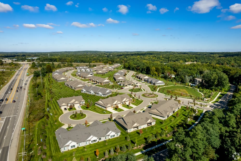 Community surrounded by trees at Encore at Deerhill in Clarkston, Michigan