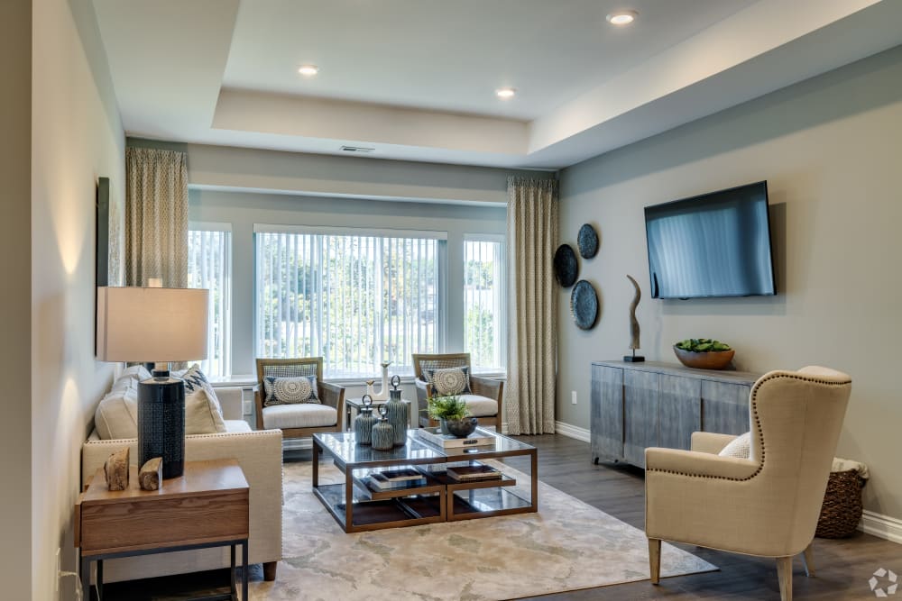 Spacious living room with huge windows at Encore at Deerhill in Clarkston, Michigan