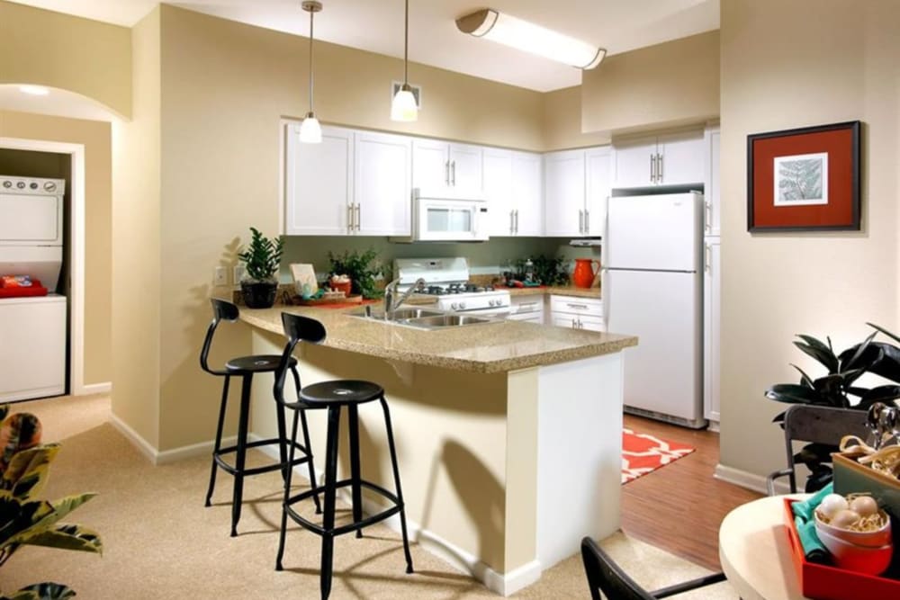 Apartment with counter seating area at Artisan at East Village Apartments in Oxnard, California