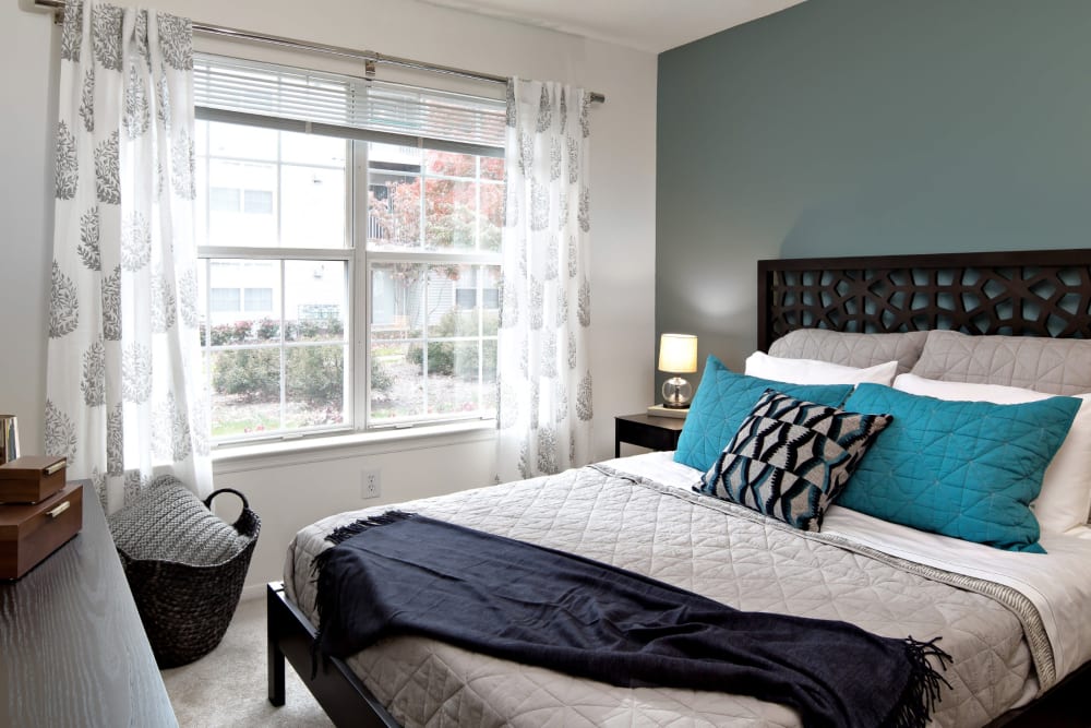Apartment bedroom with large window at Artisan at Lawrenceville in Lawrenceville, New Jersey