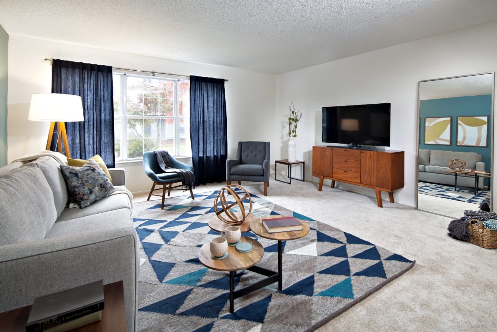 Large living room with flat screen tv at Artisan at Lawrenceville in Lawrenceville, New Jersey