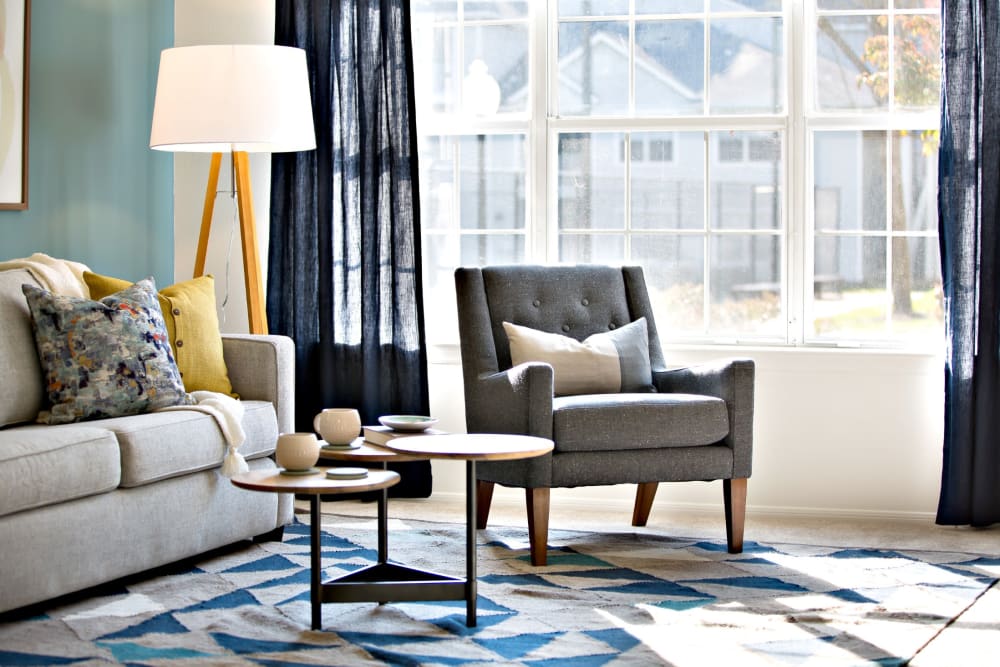 Furnished living room with large window at Artisan at Lawrenceville in Lawrenceville, New Jersey