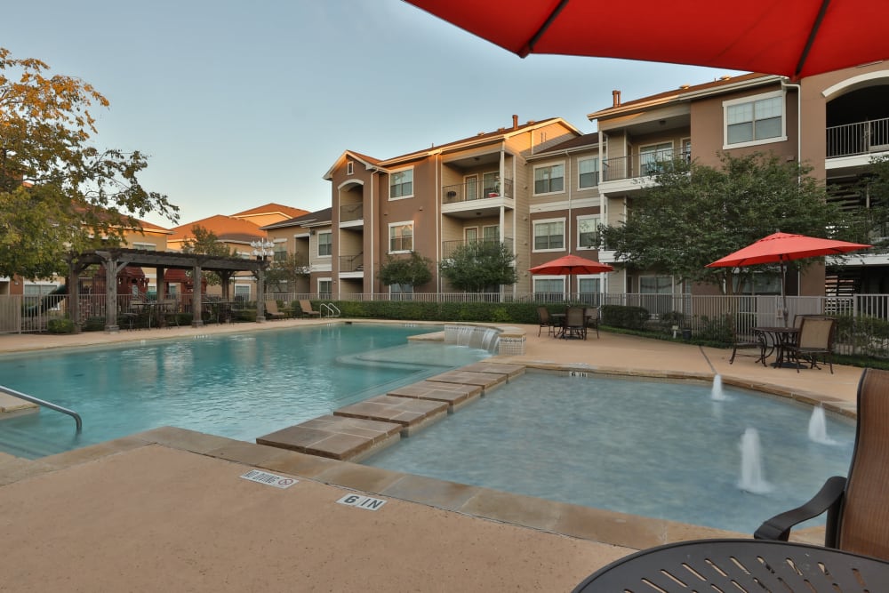 Seating next to the community pool at Cypress Creek at River Bend in Georgetown, Texas