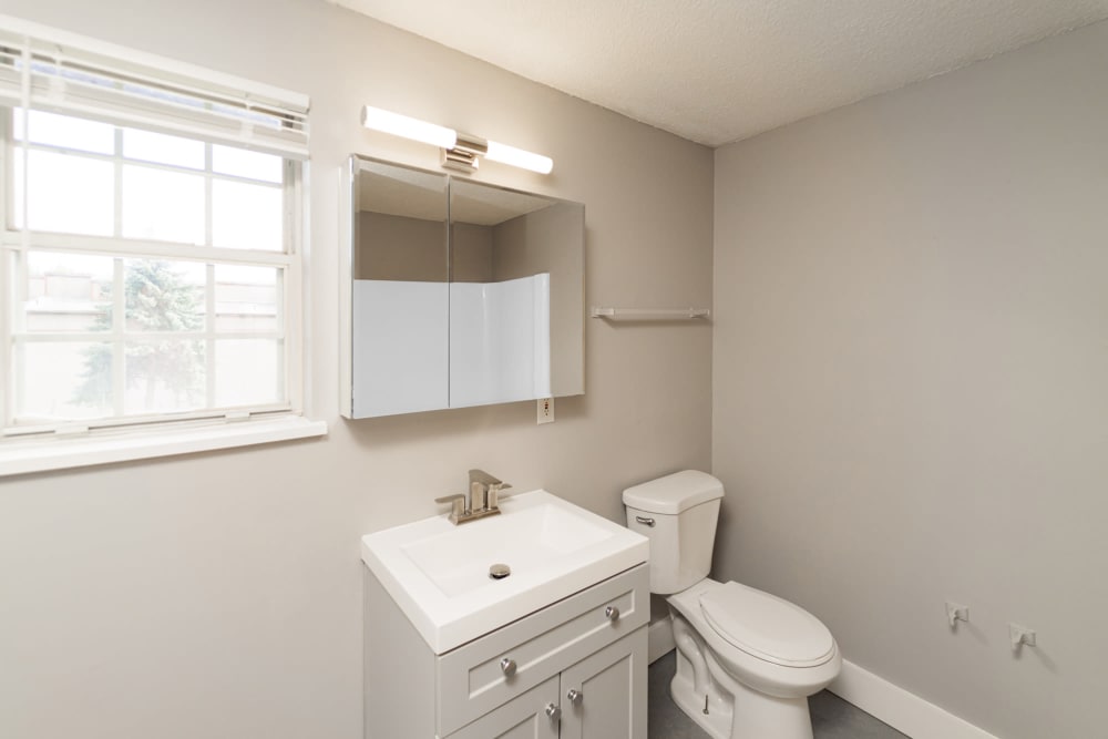 Bathroom with large vanity at Bayshore Apartments in East Haven, Connecticut