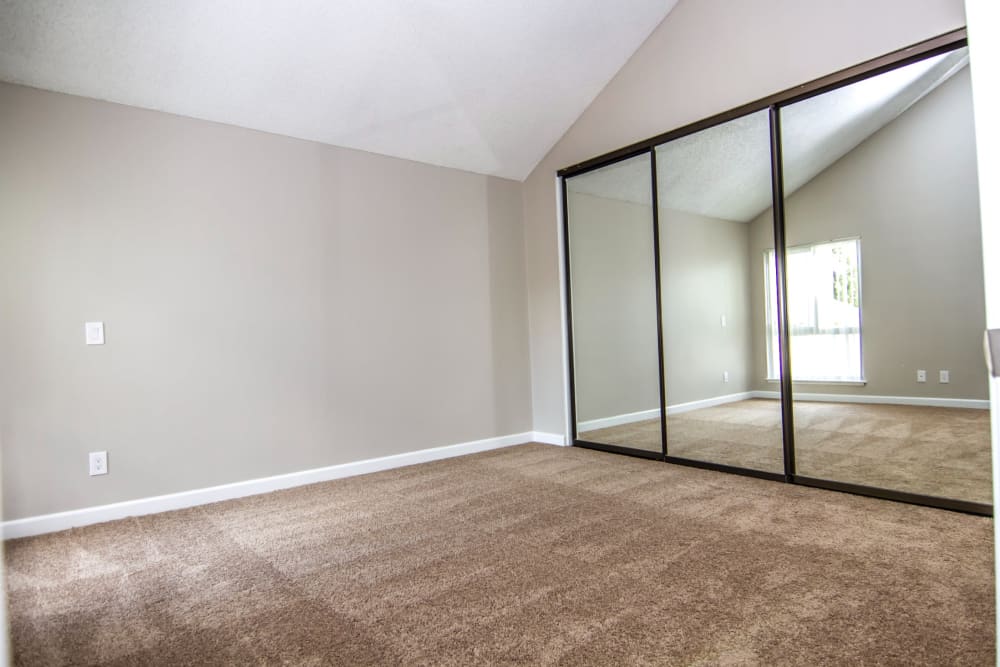 Large carpeted bedroom at Canyon Crest Views Apartments in Riverside, California